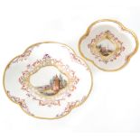 An 18th Century Meissen porcelain teabowl and saucer of quatrelobed form decorated to each central