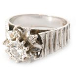 A 1970s 18ct white gold diamond flower head ring,