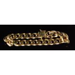 A 9ct hallmarked gentleman's filled curb link bracelet terminating in tongue and box fastener,