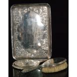 An Edwardian hallmarked silver tray of rectangular outline with embossed decoration of