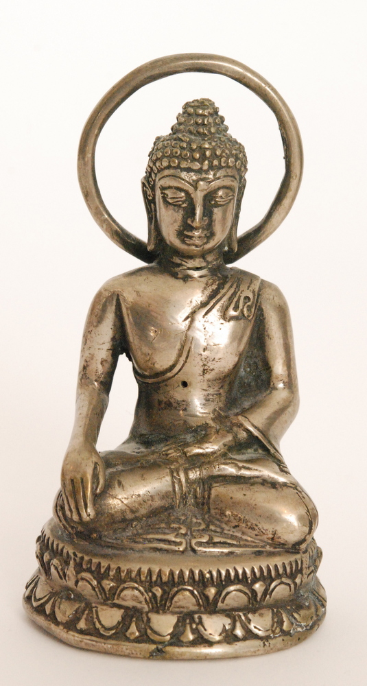 A small seated Buddha meditating in the dhyanasana pose,