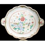 A large 19th Century Chinese export Famille Rose twin handled tray of lobed form,