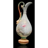 An early 20th Century Royal Worcester shape 2441 pedestal ewer decorated in the manner of George