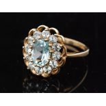 A modern 9ct hallmarked blue topaz cluster ring,