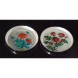 A pair of Danish sterling silver circular pin dishes each with enamel floral spray decoration to a