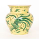 An early 20th Century Japanese vase decorated with a green dragon and a long tailed feathered bird