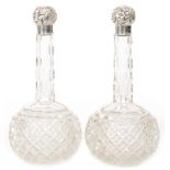 A pair of hallmarked silver and glass mallet scent bottles, clear cut glass,