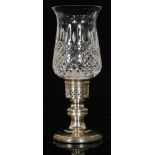 A hallmarked silver and glass candle holder,