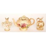 An early 20th Century Royal Worcester blush ivory teapot decorated with sprays of flowers and