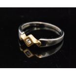 A modern 18ct white and yellow gold diamond ring,