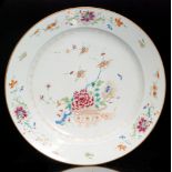 A large 19th Century Chinese Famille Rose shallow charger enamel decorated with a basket of flowers