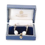 A pair of diamond and pearl pendant earrings,