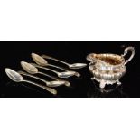 A William IV hallmarked silver melon shaped cream jug raised on four acanthus capped feet,