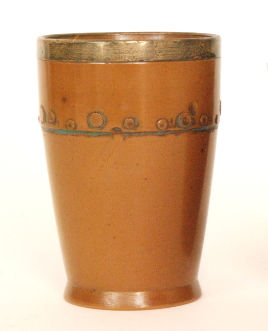 A late 19th Century Doulton Lambeth Silicon ware 'coopered' beaker with a silver collar,