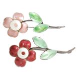 Two silver and enamel brooches, each modelled as a single flower, one with pink petals,