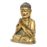 A small Chinese Ming dynasty (1368-1644) gilt bronze figure of Buddha meditating in the dhyanasana