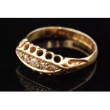 An early 20th Century 18ct boat shaped diamond five stone ring, graduated claw set stones,