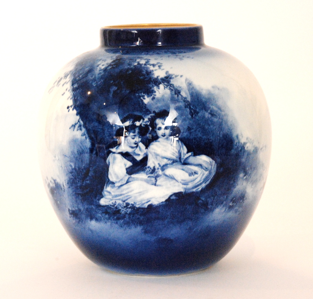 An early 20th Century Royal Doulton 'Blue Children' vase of ovoid form decorated with two girls sat