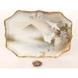 A 19th Century Japanese dressing table tray decorated with two cranes in flight amidst wisteria,