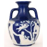 An early 20th Century copy of the Portland Vase decorated in the typical manner with relief applied