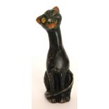 An early 20th Century seated comic cat in the manner of Louis Wain with winking pose and enamel