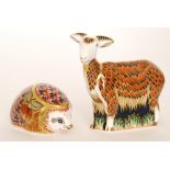 Two Royal Crown Derby paperweights comprising a nanny goat,