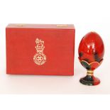 A boxed Royal Doulton Flambe egg and stand, numbered 2231 from a limited edition of 3500,