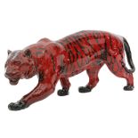 A large Royal Doulton Flambe model of a tiger modelled in a stalking stance,