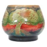 William Moorcroft - A small footed vase or jam pot base decorated in the Eventide pattern with