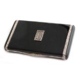Amended description - Unknown - An Art Deco black enamelled card case of rectangular outline,