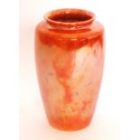 Ruskin Pottery - A barrel vase glazed in an orange lustre, impressed marks, dated 1922,