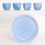 Ruskin Pottery - A crystalline glaze egg cup set comprising a footed circular stand and four