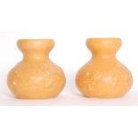 Ruskin Pottery - A pair of crystalline glaze vases each of compressed ovoid form with an open roll