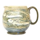 William Moorcroft - A 1930s water jug decorated in a salt glazed with three tubelined fish swimming