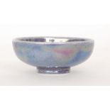 Ruskin Pottery - A miniature footed bowl decorated in an all over lavender purple lustre,