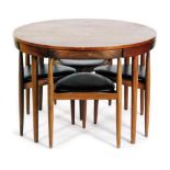 Hans Olsen - Frem Rojle - A teak dining table of circular form, raised to tapered legs,