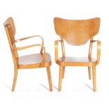 Fritz Hansen, Danish - A pair of 8072 arm chairs of beech and plywood construction,
