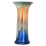 Ruskin Pottery - A large crystalline glaze lily vase of flared form decorated in a mottled blue