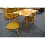 Ercol - Four blonde elm and beech Windsor lattice or 'candlestick' dining chairs, model 376,