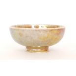 Ruskin Pottery - A miniature footed bowl decorated in an all over mottled blue and sand coloured