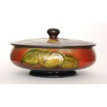 Walter Moorcroft - A large powder bowl and cover decorated in the Flambe Clematis pattern with