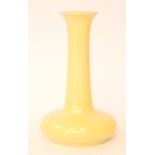 Ruskin Pottery - A vase of compressed form with a tall flared collar neck,