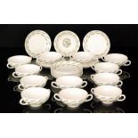 Eric Ravilious - Wedgwood - A set of twelve twin handled Garden pattern soup cups and saucer stands