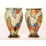 Crown Devon - A pair of 1930s Art Deco vases of footed form decorated with stylised flowers and