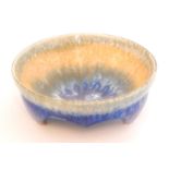 Ruskin Pottery - A crystalline glaze tri-footed bowl decorated in a streaked green to orange to