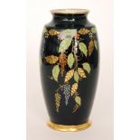 Carlton Ware - A 1930s Art Deco vase of footed barrel form decorated in the Leaf pattern with gilt
