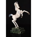 Istvan Komaromy - A figural lamp work group of a prancing stallion in tonal white opalescent glass,