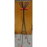 Unknown - A 1950s wrought iron coat stand in black painted finish with red ball terminals.