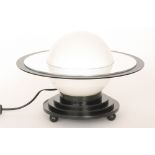 Unknown - A 'Saturn' planet style table lamp, the opaque shade with three black,