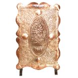 In the manner of William Mawson - A copper firescreen of rectangular cartouche form,